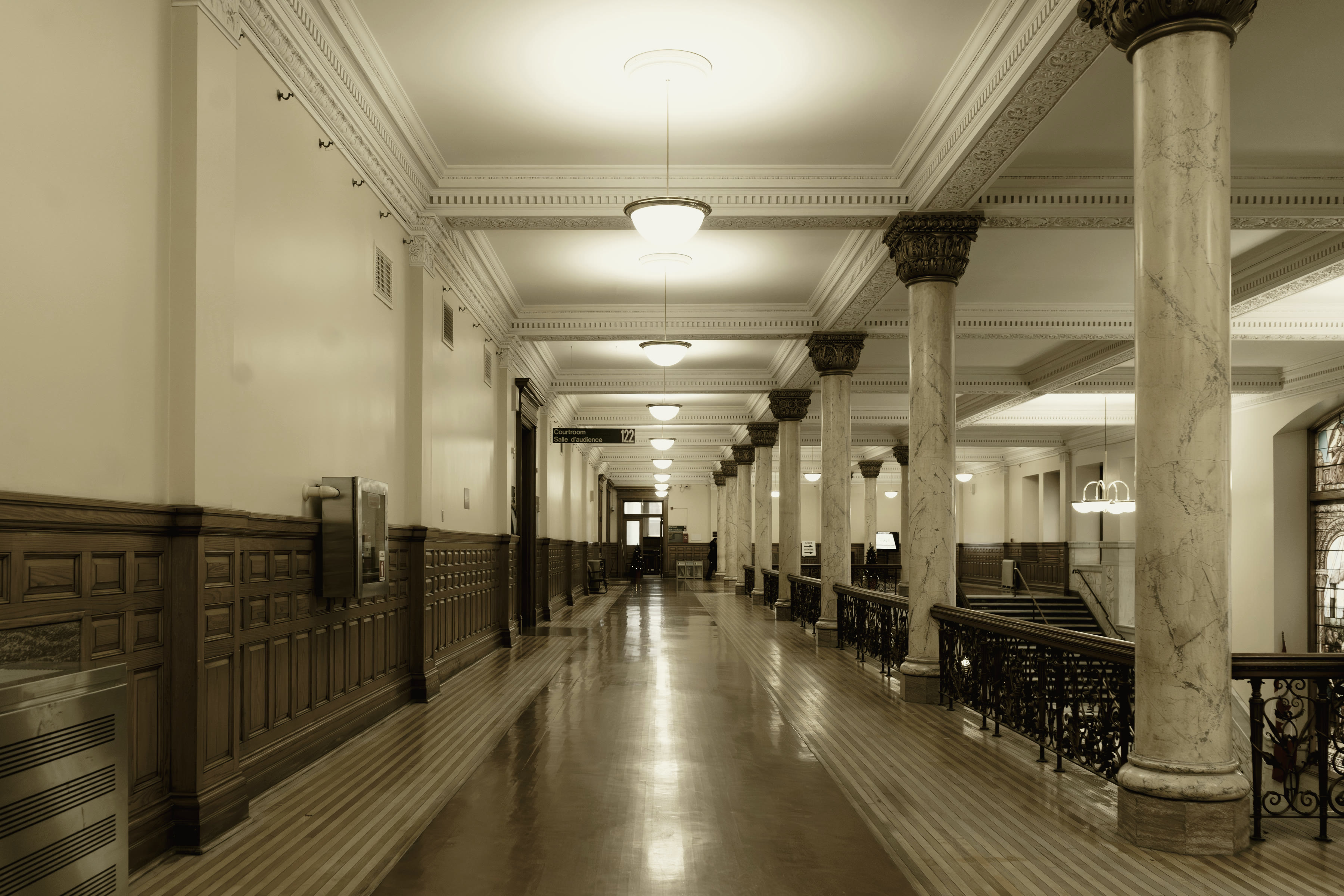 A formal institutional interior, empty and lit from above.