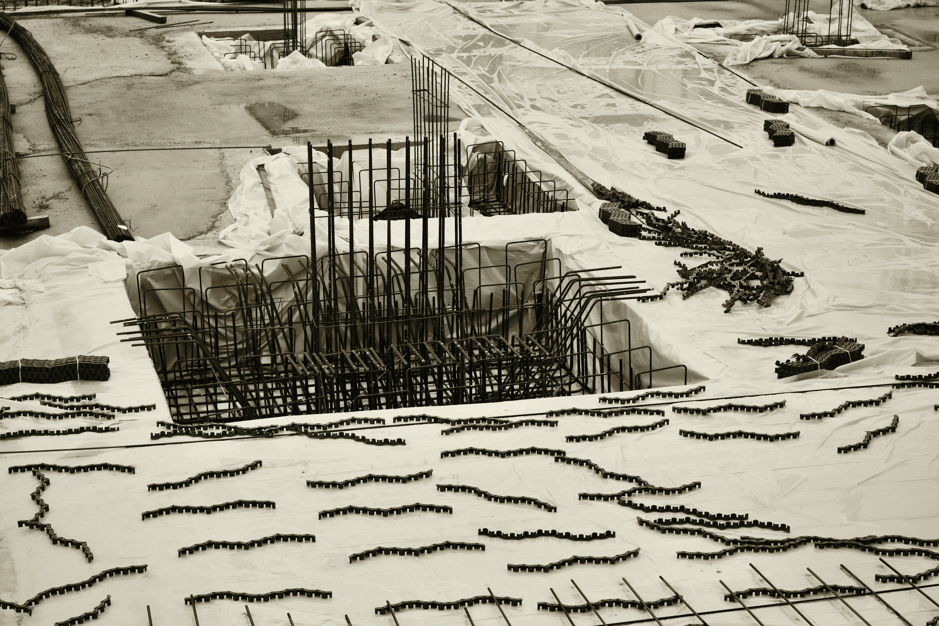 Dense grid of steel reinforcement bars tied in place before a concrete pour.